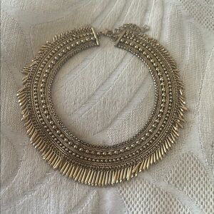 Gold Collar Necklace with Intricate Metalwork and Fringe